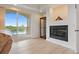 Comfortable living room featuring a fireplace, water view, and sliding glass door at 43 Bayview S Ct # A, St Petersburg, FL 33711