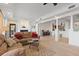 Spacious living room with neutral colors, fireplace, and views into the kitchen at 43 Bayview S Ct # A, St Petersburg, FL 33711