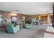 An elegant lounge features plush green armchairs, a stylish coffee table, and tasteful decor at 43 Bayview S Ct # A, St Petersburg, FL 33711