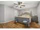 Main bedroom featuring a king-size bed and gray accents at 9716 Fox Chapel Rd, Tampa, FL 33647