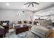 Bright and airy living room featuring a large sectional sofa at 9716 Fox Chapel Rd, Tampa, FL 33647