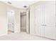 Spacious bedroom with plush carpeting and an ensuite bathroom at 23176 Pachino Way, Lutz, FL 33549