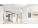 Modern white kitchen with stainless steel appliances and an island at 23176 Pachino Way, Lutz, FL 33549