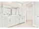 Bathroom with double vanity and access to a walk-in closet at 23176 Pachino Way, Lutz, FL 33549