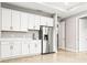 White kitchen cabinets, stainless steel appliances and quartz countertops at 23176 Pachino Way, Lutz, FL 33549