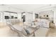 Open concept living room and kitchen with modern appliances at 23176 Pachino Way, Lutz, FL 33549