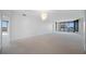 Spacious living room with wall-to-wall carpeting and city views at 1 Beach Se Dr # 1208, St Petersburg, FL 33701