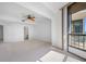 Bedroom with ceiling fan and balcony access at 1 Beach Se Dr # 1208, St Petersburg, FL 33701