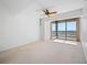 Spacious bedroom with ceiling fan and water view at 1 Beach Se Dr # 1208, St Petersburg, FL 33701