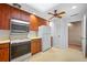 Galley kitchen, with wood cabinets and appliances at 1 Beach Se Dr # 1208, St Petersburg, FL 33701