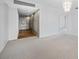 Open living area with carpet and hallway access at 1 Beach Se Dr # 1208, St Petersburg, FL 33701