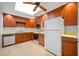 Efficient kitchen with wood cabinets and appliances at 1 Beach Se Dr # 1208, St Petersburg, FL 33701