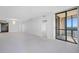 Open living room with access to balcony and city views at 1 Beach Se Dr # 1208, St Petersburg, FL 33701