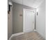 White door entry to condo unit with neutral wall tones and carpet at 1 Beach Se Dr # 1208, St Petersburg, FL 33701