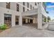 Modern building exterior with covered entryway and brick pavers at 1 Beach Se Dr # 1208, St Petersburg, FL 33701