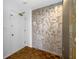 Condo entry with patterned wallpaper and wood flooring at 1 Beach Se Dr # 1208, St Petersburg, FL 33701