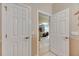 View through hallway showing living room with hardwood floors at 108 Aberdeen Pond Dr, Apollo Beach, FL 33572