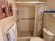 This bathroom offers a walk-in shower with safety bars at 2385 Tahitian Ln # 63, Clearwater, FL 33763