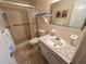 This bathroom offers a walk-in shower and tile flooring at 2385 Tahitian Ln # 63, Clearwater, FL 33763