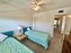 Bedroom with two twin beds, ceiling fan and closet at 2385 Tahitian Ln # 63, Clearwater, FL 33763