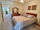 Cozy bedroom with carpeted floors and dresser at 2385 Tahitian Ln # 63, Clearwater, FL 33763