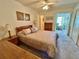 This bedroom features a ceiling fan, carpet and decor at 2385 Tahitian Ln # 63, Clearwater, FL 33763