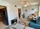Open-concept living room with dining area and comfortable seating at 2385 Tahitian Ln # 63, Clearwater, FL 33763