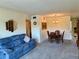 Cozy living area with comfortable furniture, neutral carpet, and a dining table with seating for four at 2385 Tahitian Ln # 63, Clearwater, FL 33763