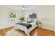 Bedroom with hardwood floors, a ceiling fan and a bed at 4735 1St S Ave, St Petersburg, FL 33711