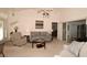 Open living room with seating area and adjacent dining area at 2451 E Del Webb Blvd, Sun City Center, FL 33573