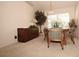 Spacious dining area with a wooden table and chairs near a window at 2451 E Del Webb Blvd, Sun City Center, FL 33573
