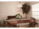 Round dining table with green striped chairs in a bright dining room at 2451 E Del Webb Blvd, Sun City Center, FL 33573