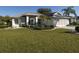 Single-story home with well-maintained landscaping at 2451 E Del Webb Blvd, Sun City Center, FL 33573