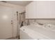 Laundry room with washer, dryer, and cabinets at 2451 E Del Webb Blvd, Sun City Center, FL 33573