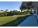 Spacious backyard with a patio and plenty of green space at 2451 E Del Webb Blvd, Sun City Center, FL 33573