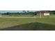 Tennis courts with surrounding fence and landscaping at 2451 E Del Webb Blvd, Sun City Center, FL 33573