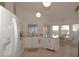 White kitchen with stainless steel appliances and an eat-in area at 2451 E Del Webb Blvd, Sun City Center, FL 33573