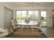 Bright sunroom with table and chairs at 2451 E Del Webb Blvd, Sun City Center, FL 33573