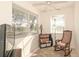 Sunroom with rocking chair and window seat at 2451 E Del Webb Blvd, Sun City Center, FL 33573
