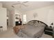 Spacious bedroom with king bed, ceiling fan, and large window at 2451 E Del Webb Blvd, Sun City Center, FL 33573