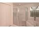 Bathroom featuring a shower and tub at 2451 E Del Webb Blvd, Sun City Center, FL 33573