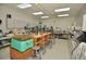 Spacious workshop with multiple workbenches and tools at 2451 E Del Webb Blvd, Sun City Center, FL 33573