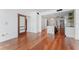 Open living area with hardwood floors and views into the modern kitchen at 912 Channelside Dr # 2607, Tampa, FL 33602