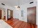 Hallway with hardwood floors, leading to bedrooms and laundry at 912 Channelside Dr # 2607, Tampa, FL 33602