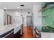 Modern kitchen with marble countertops, stainless steel appliances, and green geometric backsplash at 912 Channelside Dr # 2607, Tampa, FL 33602
