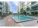 Inviting community pool with surrounding lounge chairs at 912 Channelside Dr # 2607, Tampa, FL 33602