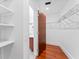 Spacious walk-in closet with built-in shelving and wood floors at 912 Channelside Dr # 2607, Tampa, FL 33602