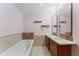 Spa-like bathroom with double vanity, soaking tub and tiled floors at 912 Channelside Dr # 2607, Tampa, FL 33602