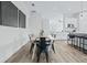 Dining room with long wooden table and black chairs at 2316 S 46Th St, Tampa, FL 33619