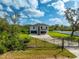 Modern home with driveway and black metal gate at 2316 S 46Th St, Tampa, FL 33619